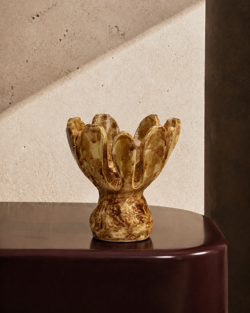 Larger tulip-shaped stoneware vase in amber-brown glaze with scalloped petal rim, styled on a tabletop