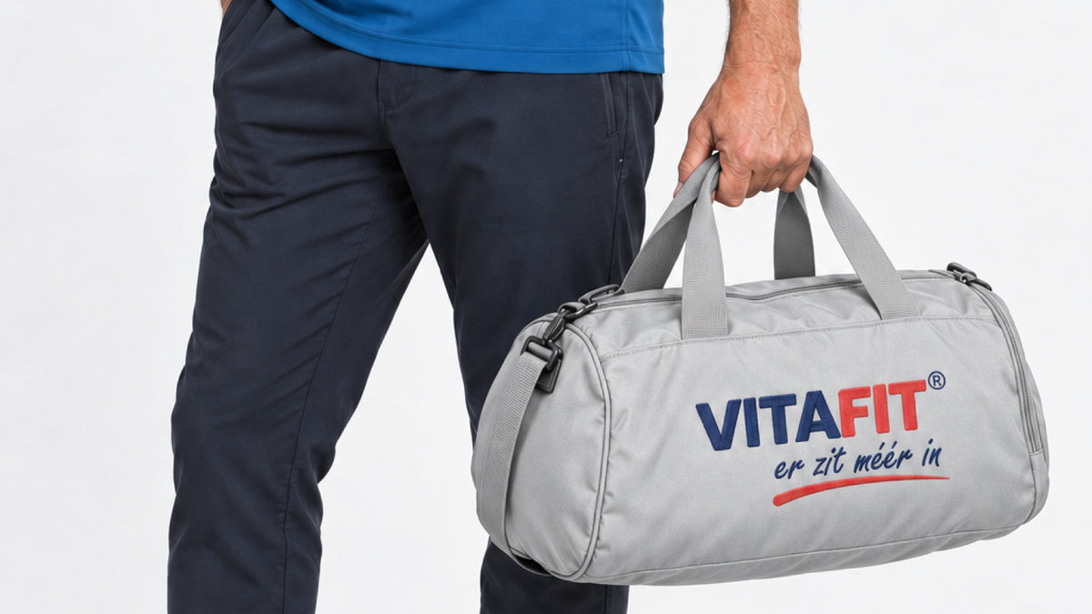 Grey VITAFIT sports bag carried by hand