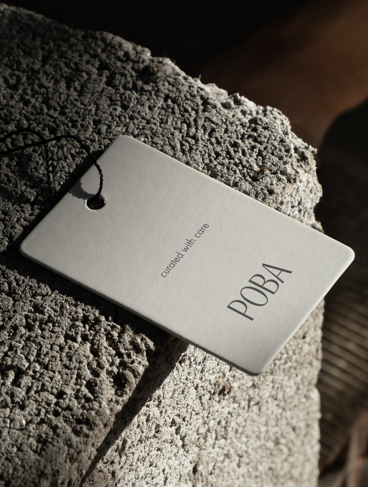 POBA hangtag on natural stone