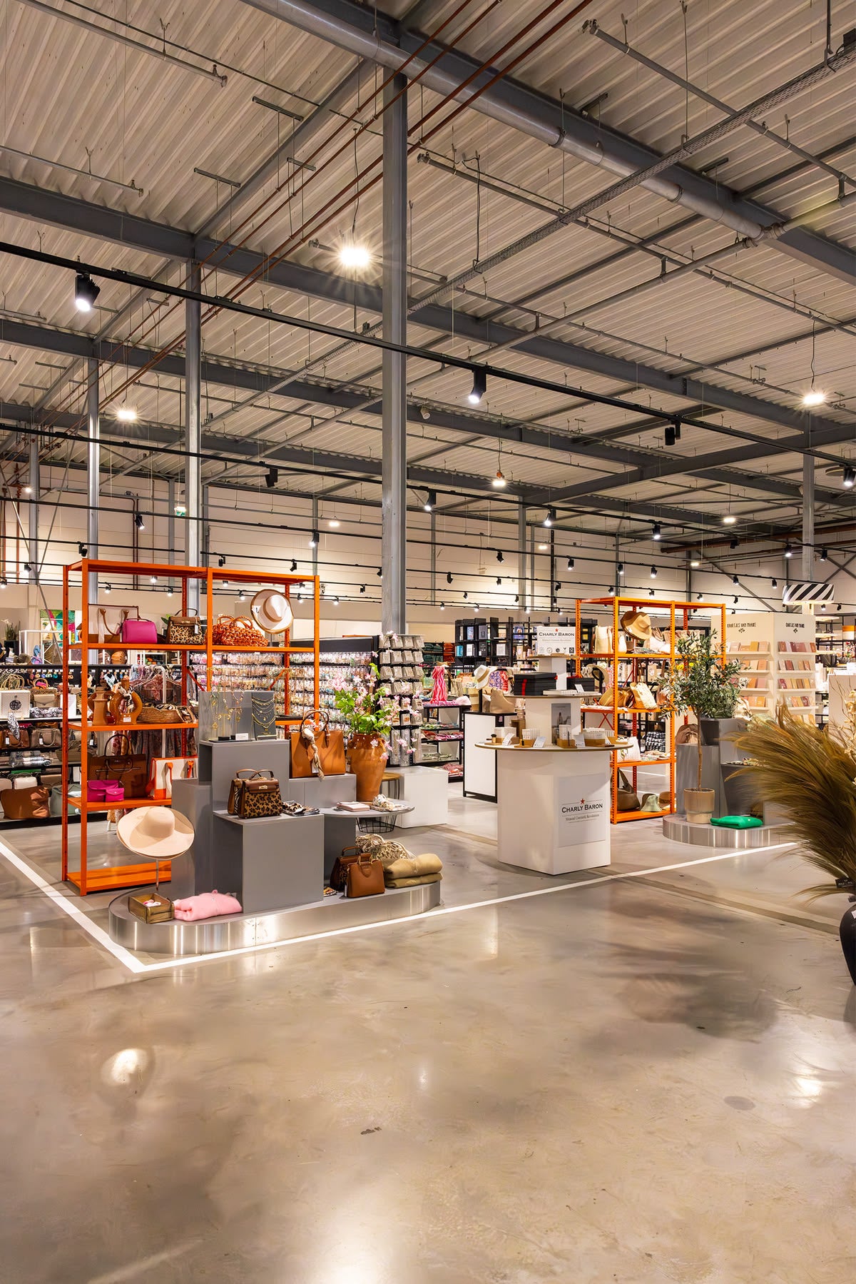 Bags and accessories zone with orange racks