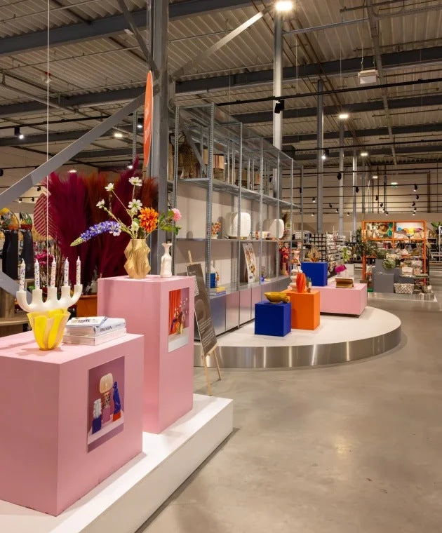 Pink plinths and colour blocks on a stainless steel podium